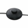 Industrijska podna lampa Steinhauer Mexlite Nové u mat crnoj boji sa zlatnom unutrašnjošću abažura pored radnog stola